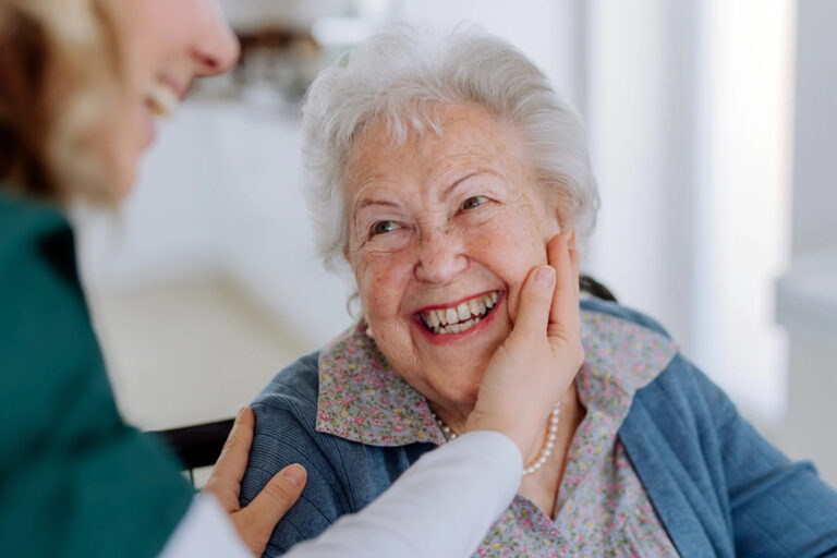 happy senior with perfect solutions caregiver scaled 1 768x512