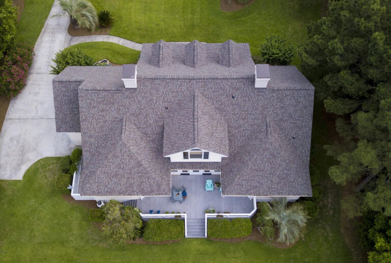 aerial view of large home with new roof on beautiful 768x516
